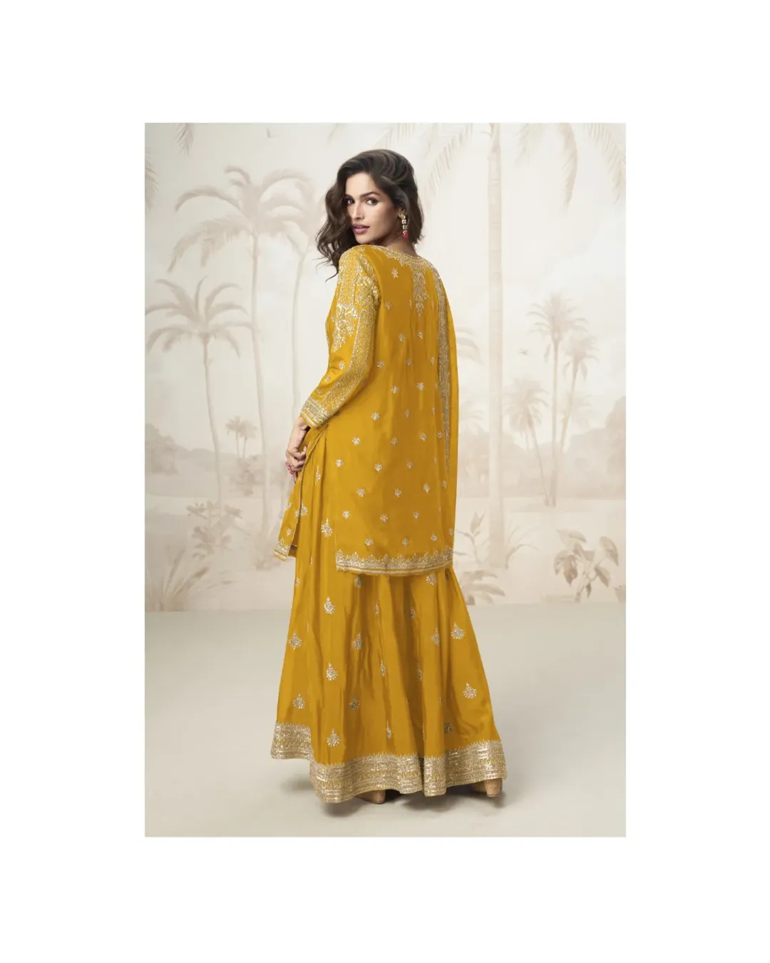 MUMTAZ X LABEL AASHIRWADElegant mustard yellow ethnic suit with silver embroidery, featuring a (1)